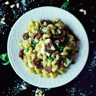 Pesto Pasta with Prosciutto, Peas, and Sun-Dried Tomatoes by Three in Three