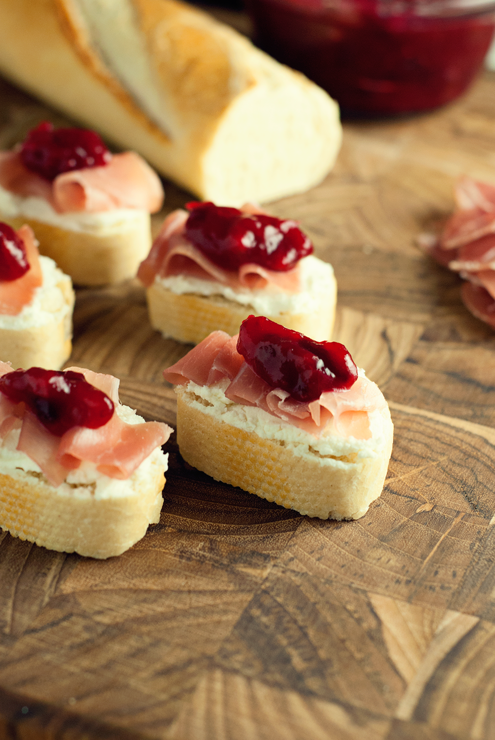 Make the perfect party appetizer with these goat cheese, prosciutto, and cranberry crostini!