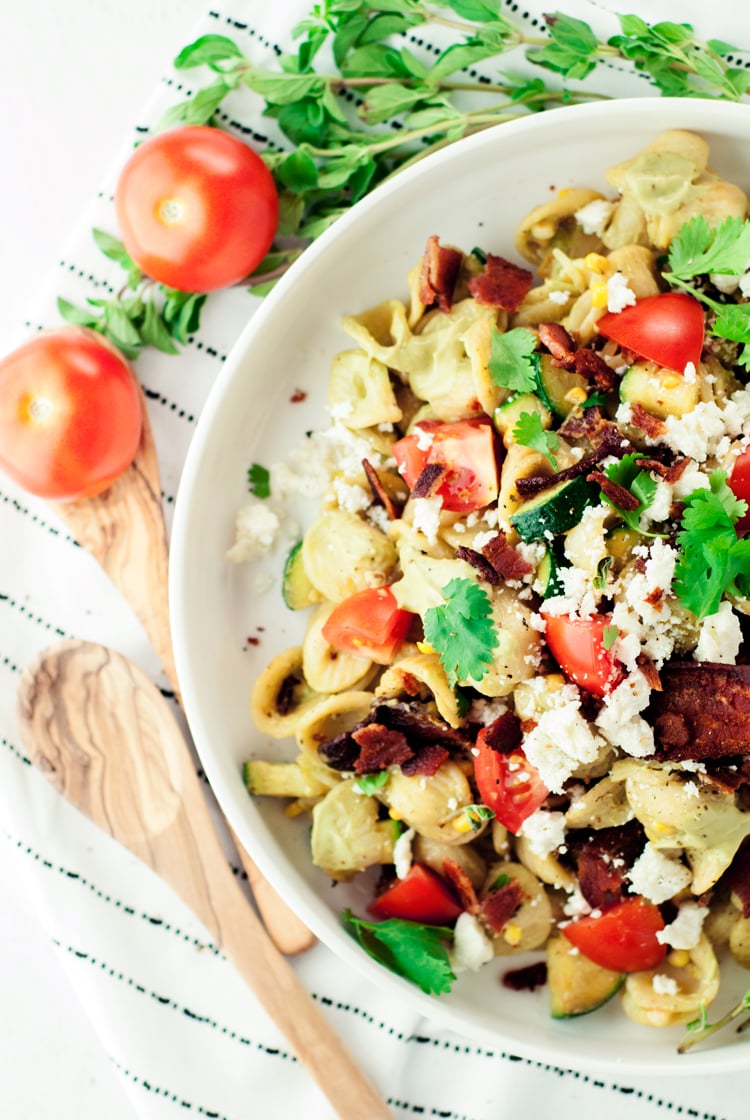 Throw out that boring old pasta salad and say hello to delicious with this Bacon Pasta Salad featuring and amazing Avocado Crema Sauce! | asimplepantry.com