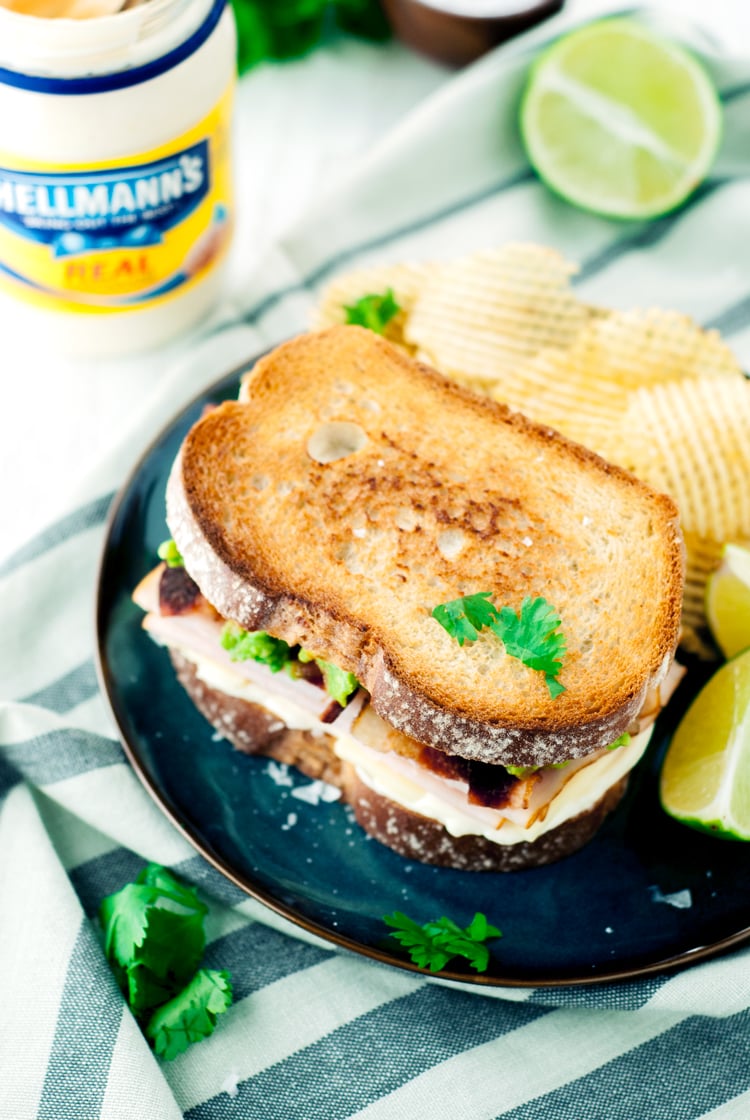 Get your lunch on with this amazingly delicious and simple Turkey Bacon Avocado Sandwich! Give it a fun twist with guacamole instead of traditional sliced avocado! | asimplepantry.com