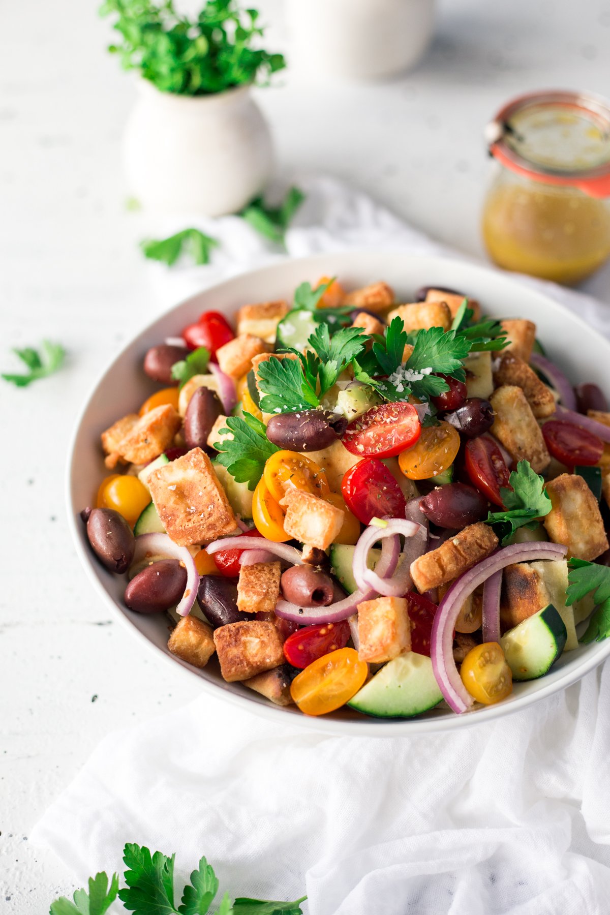 If you're looking for appetizer recipes, or just a damn good salad, this Simple Greek Panzanella with Saganaki is pure perfection! Ready to eat in 15 minutes! | asimplepantry.com
