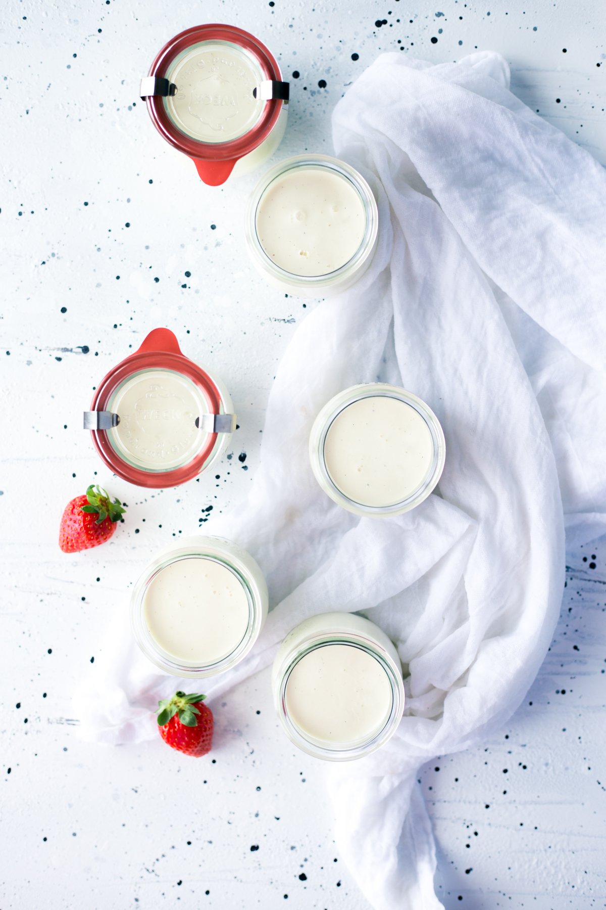 Get ready to enjoy a dessert that is so easy to make, but so gourmet, you'll wow your friends and family alike! Dive into some Creme Fraiche Panna Cotta with Rosemary Macerated Strawberries! | asimplepantry.com