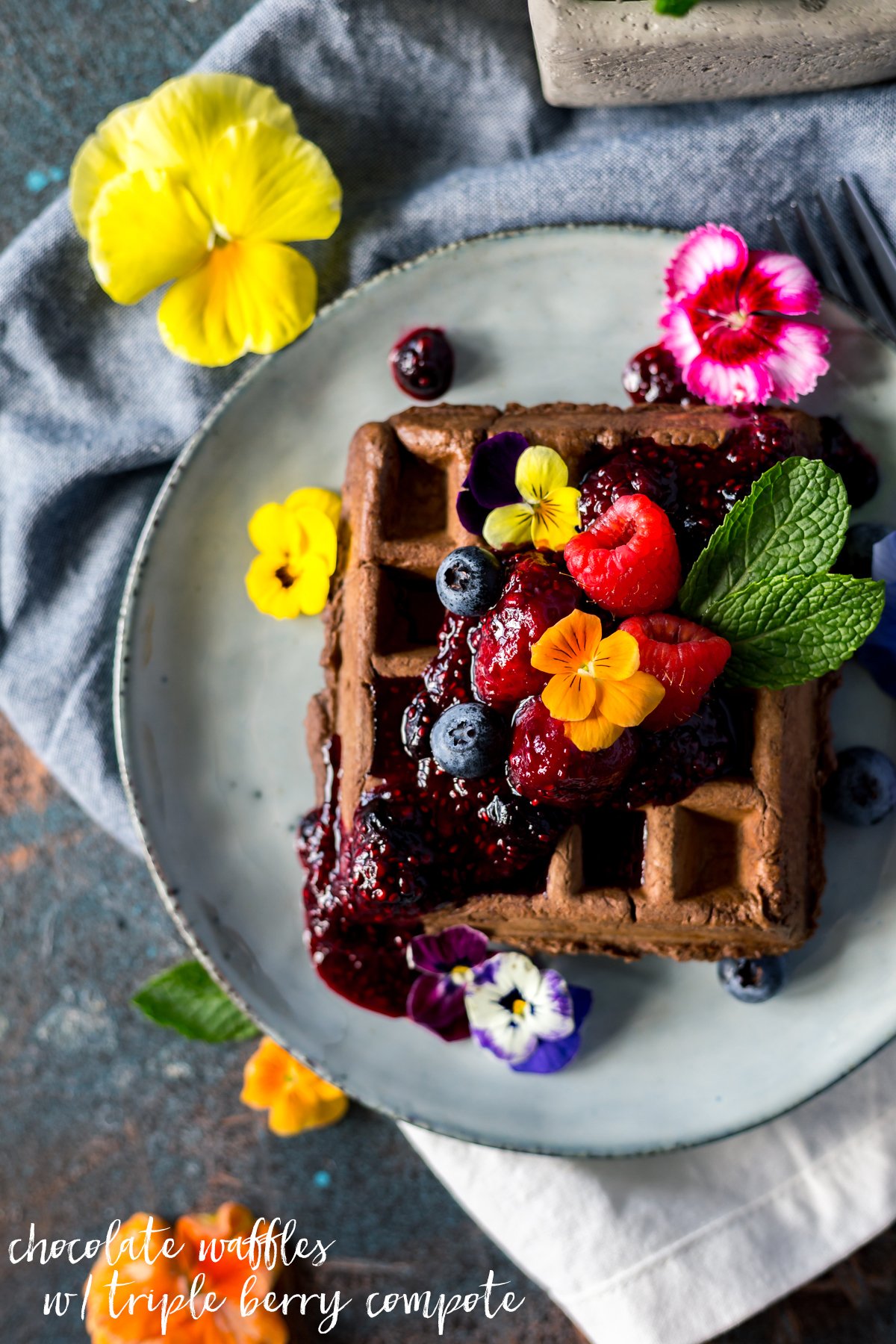 Breakfast or dessert? You decide when you whip up these sweet and savory waffle recipes! Dig into chocolate waffles with triple berry compote today! | asimplepantry.com