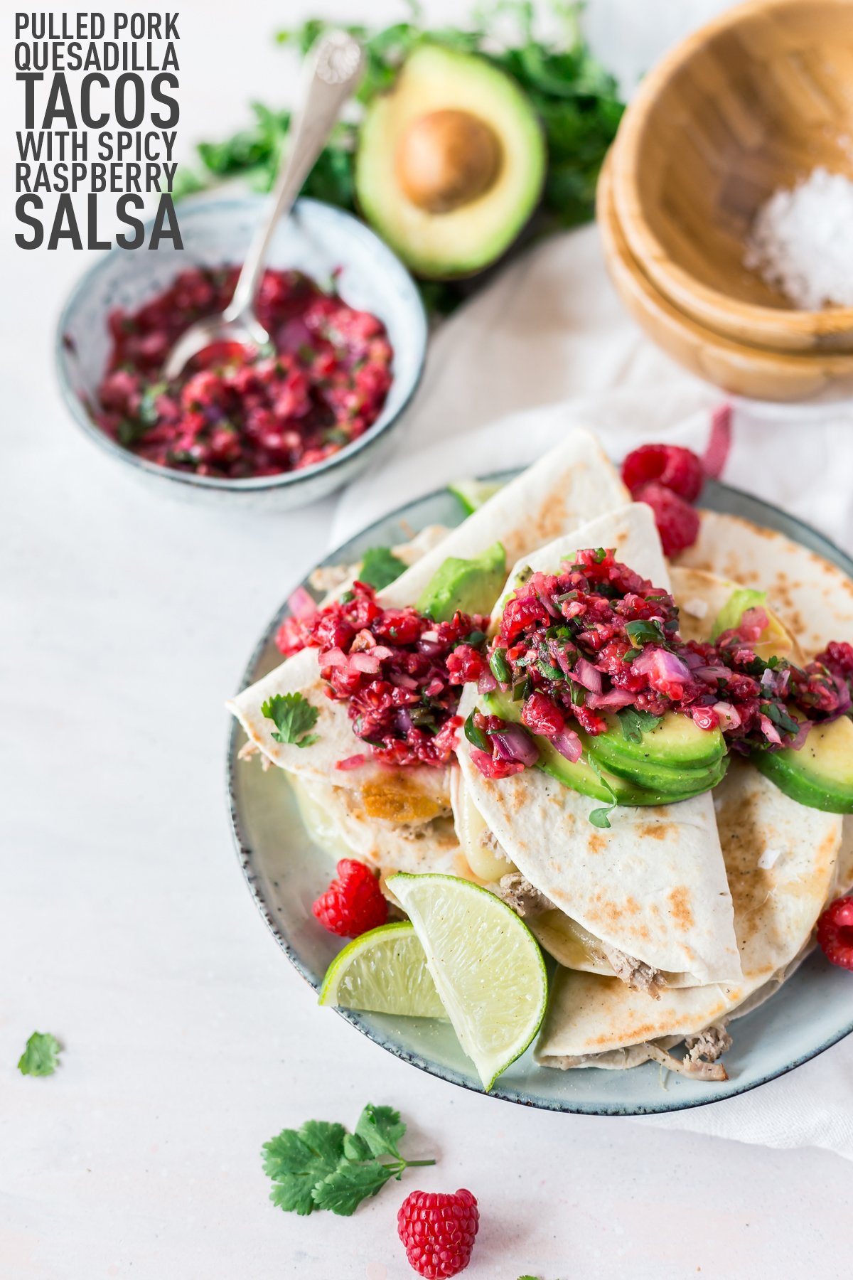 In terms of easy Mexican recipes, these quick and tasty pulled pork quesadilla tacos with spicy raspberry salsa are ready in 30 minutes! Dinner is served! | asimplepantry.com