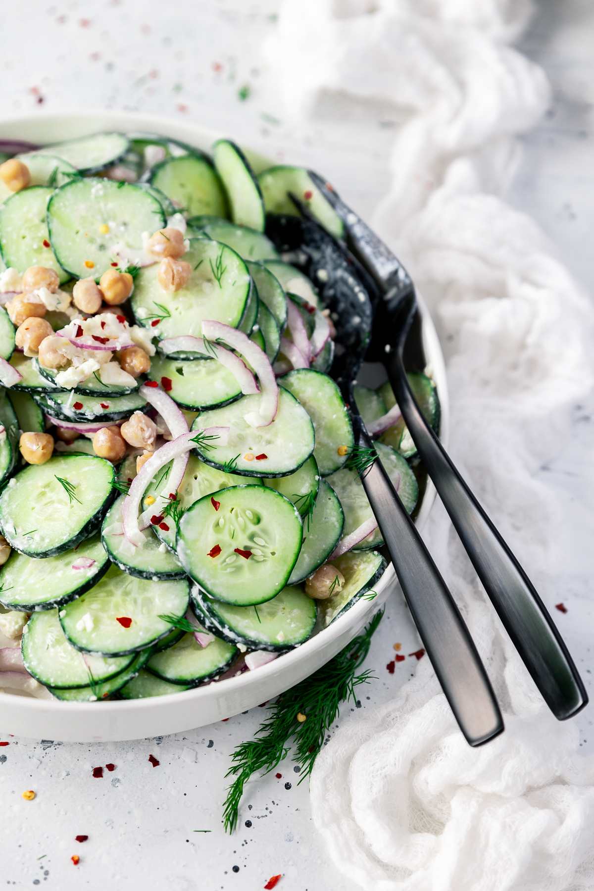 creamy cucumber salad with chickpeas, red onion, feta, and dill.