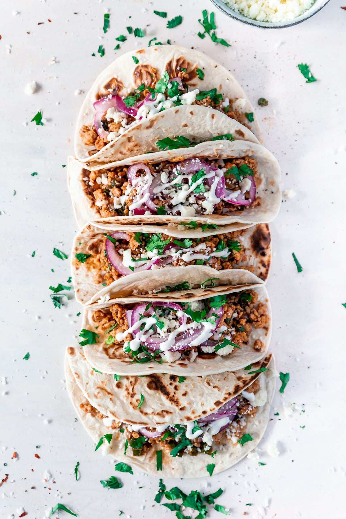 overhead view of weeknight pork carnitas tacos by Minneapolis food blogger A Simple Pantry.