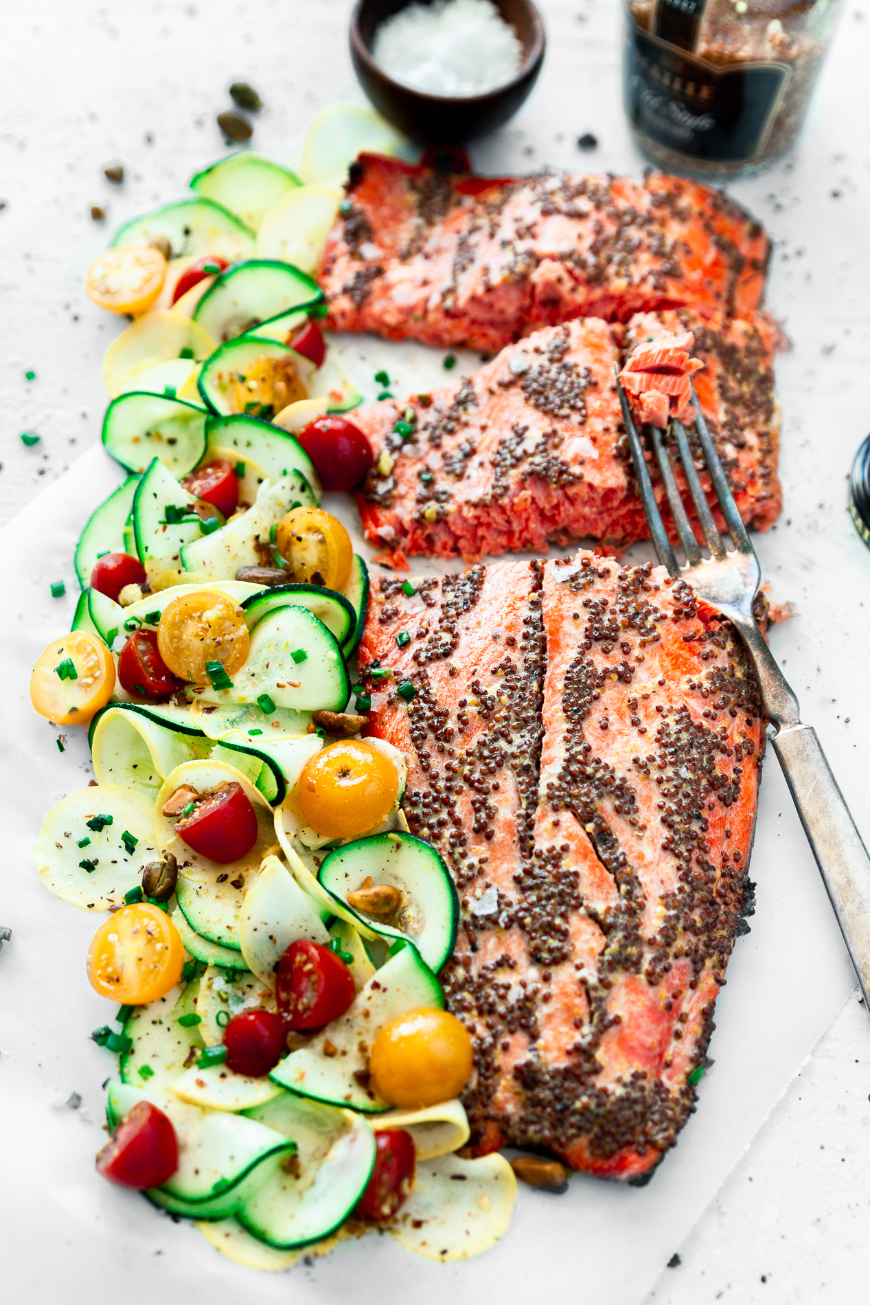 angled view of mustard salmon with citrus squash salad