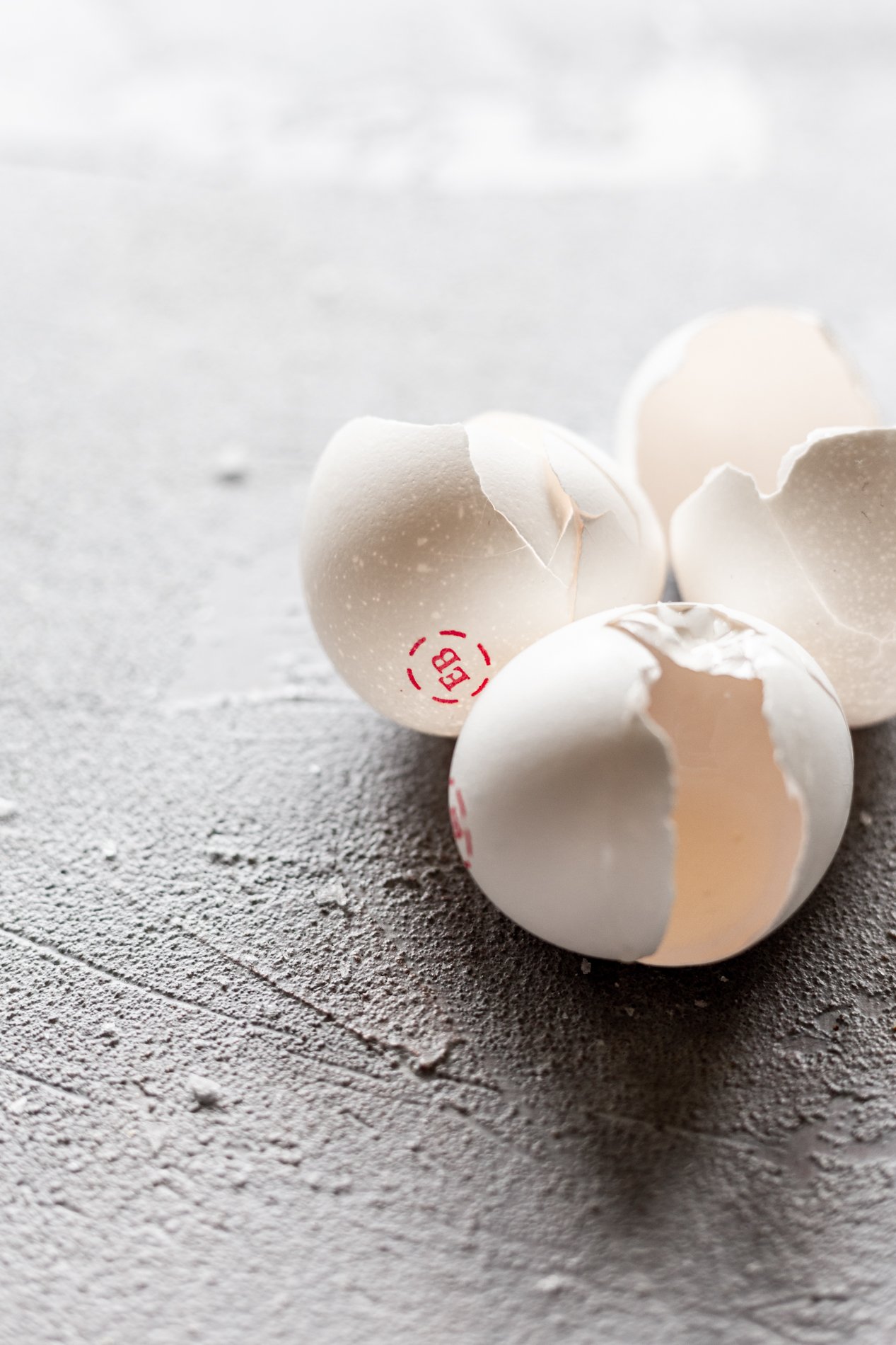angled view of cracked Eggland's Best eggshells after being used in harissa baked eggs recipe