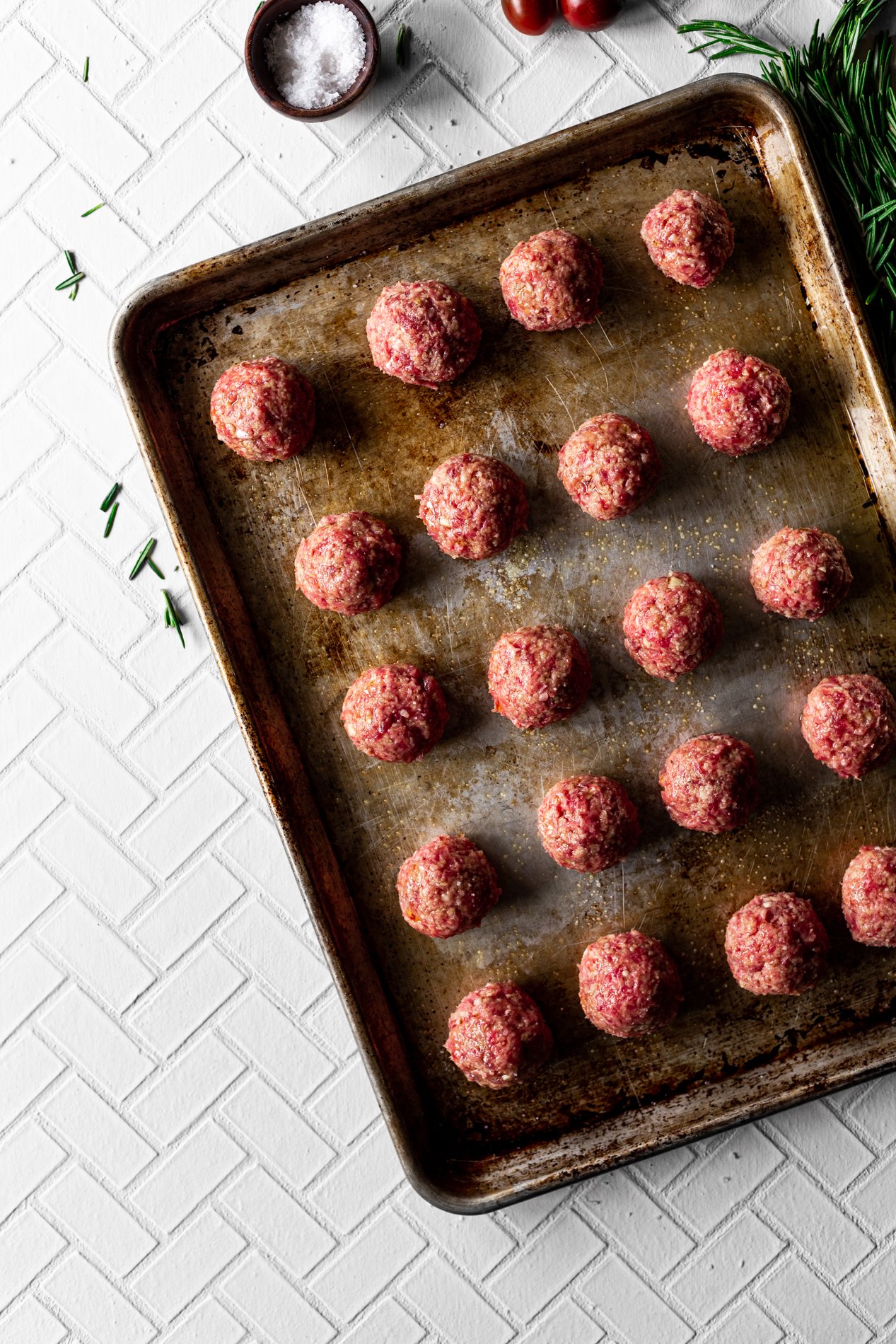 sheet pan of lamb meatballs before being baked in the oven