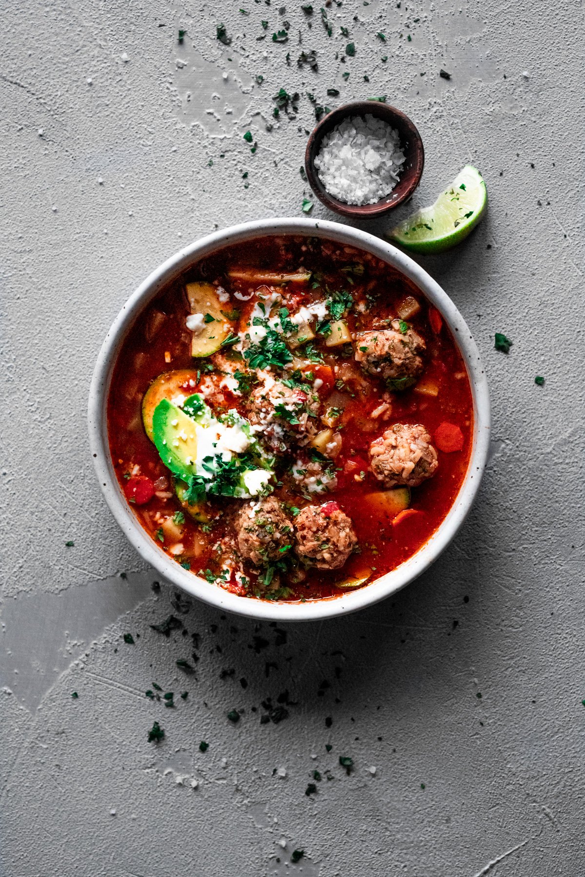 Bowl of soup with veggie broth and mexican meatballs, albondigas soup