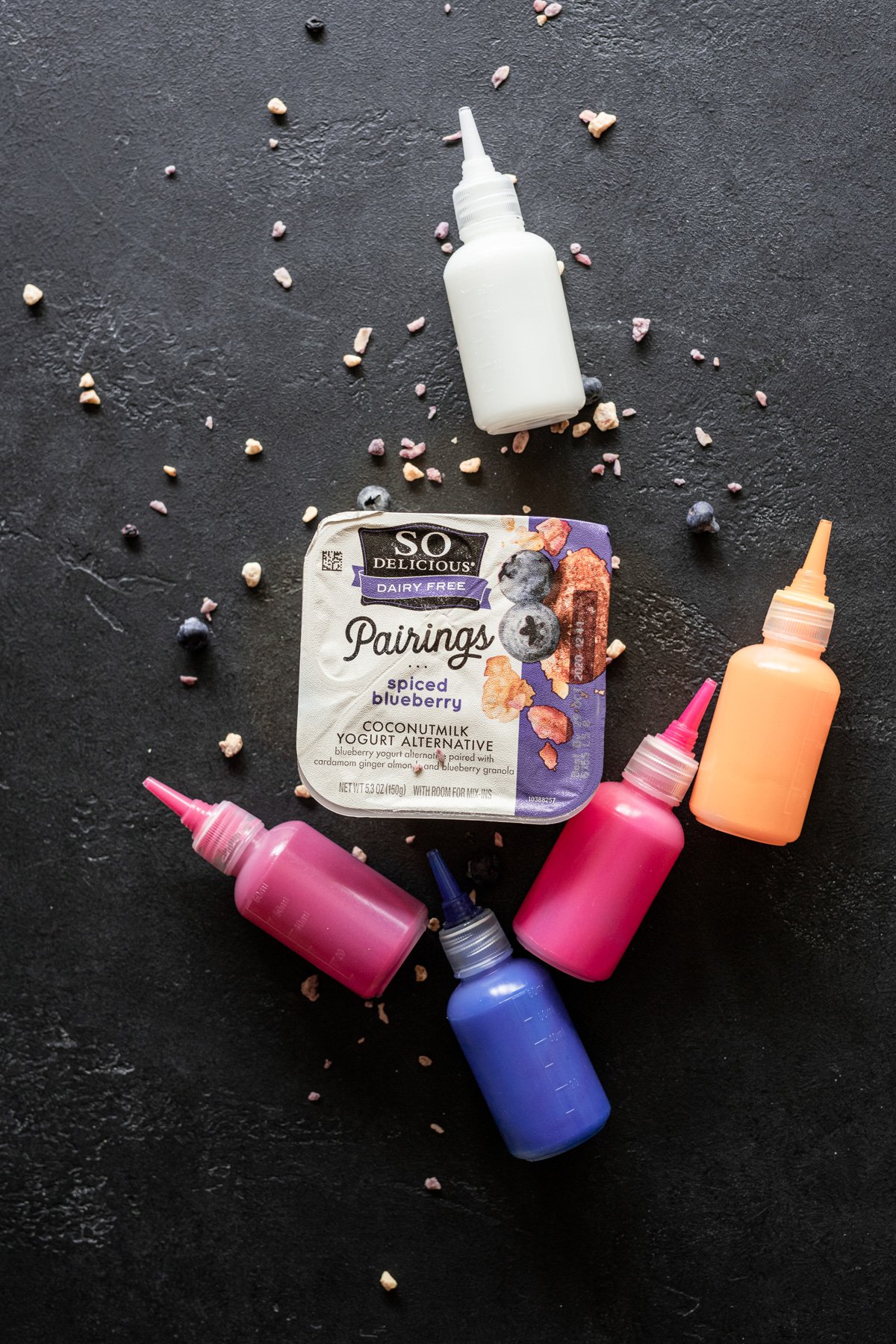 so delicious dairy free pairings in spiced blueberry with tie-dye colored bottles of yogurt