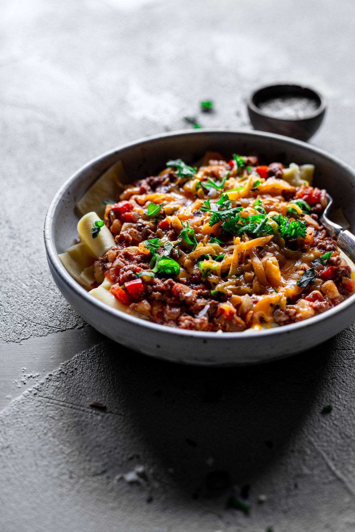 delicious weeknight meat sauce recipe with green onions, parsley, and cheddar cheese